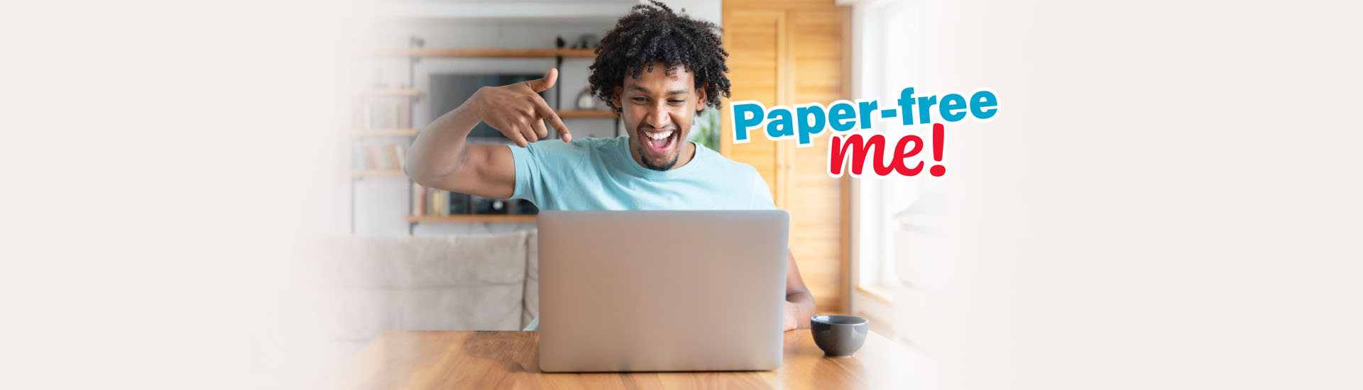 happy african american man pointing at laptop