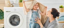 mom and child next to dryer