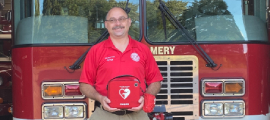 first responder instructor holding defibrillator